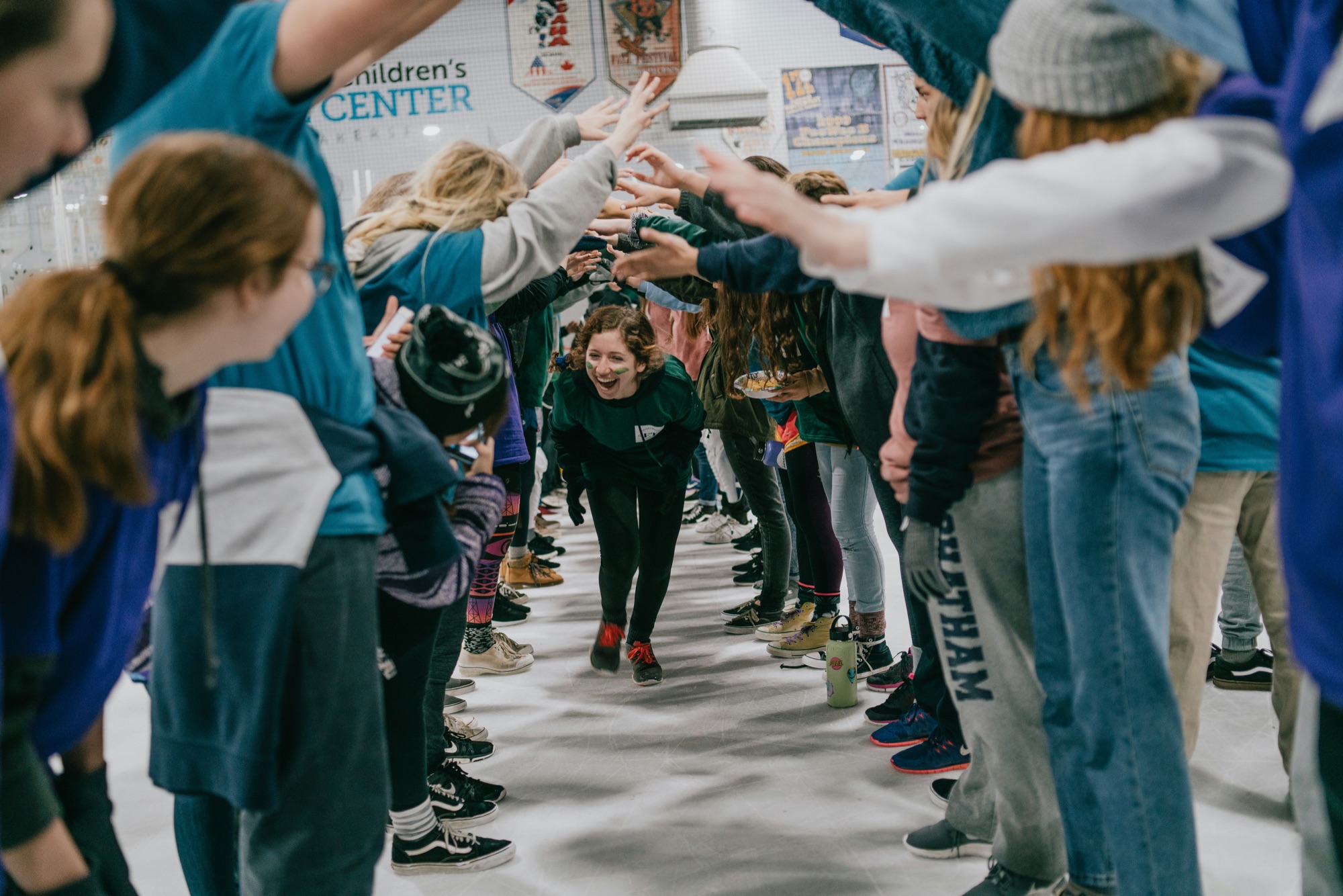 Students cheering in a school spirit tunnel
