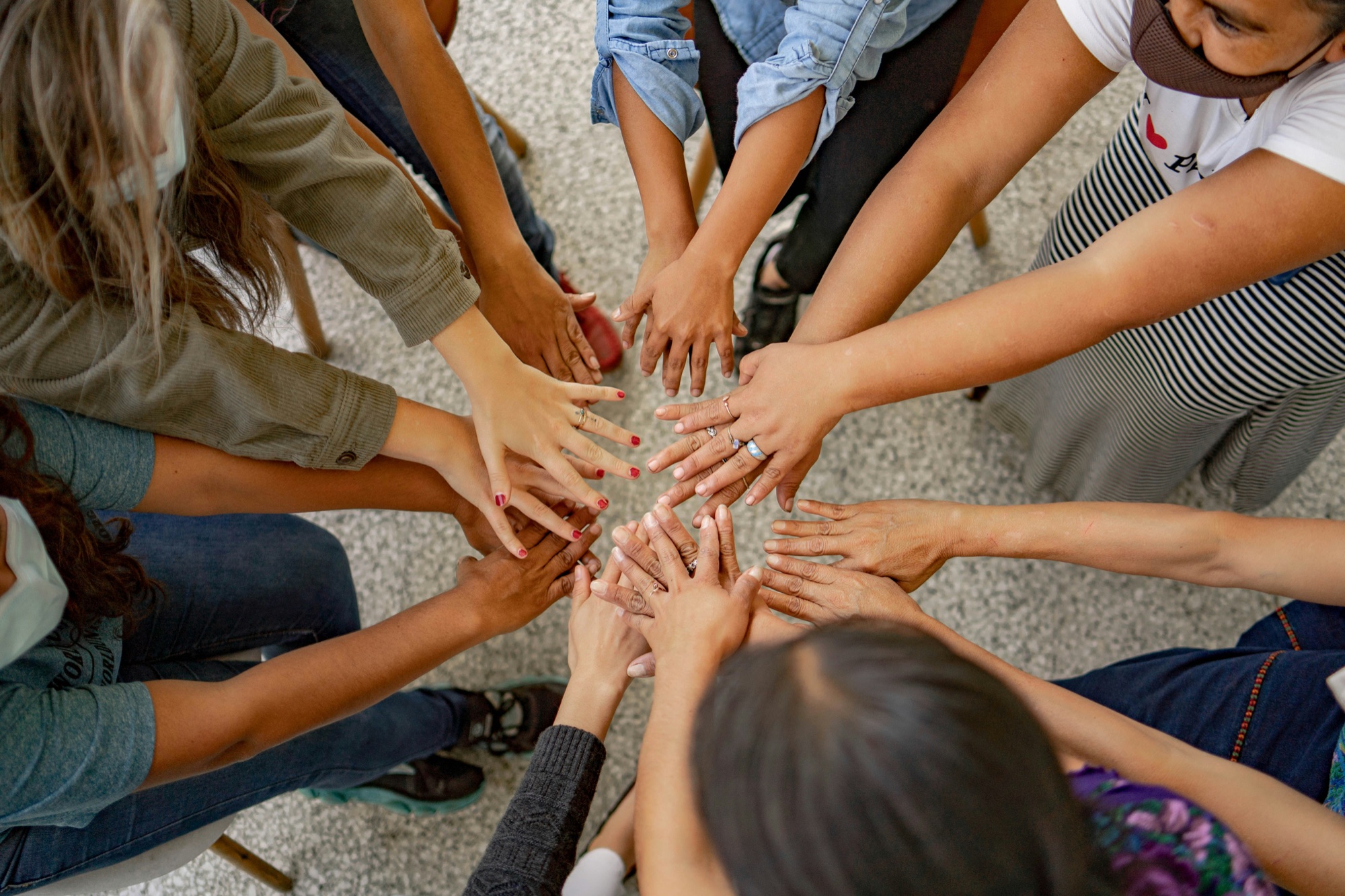 Students and supporters joining hands for a school fundraiser